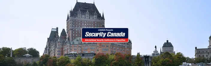 Security Canada at Château Frontenac Château Frontenac with 'Security Canada' banner; historic castle-like hotel, autumn trees.