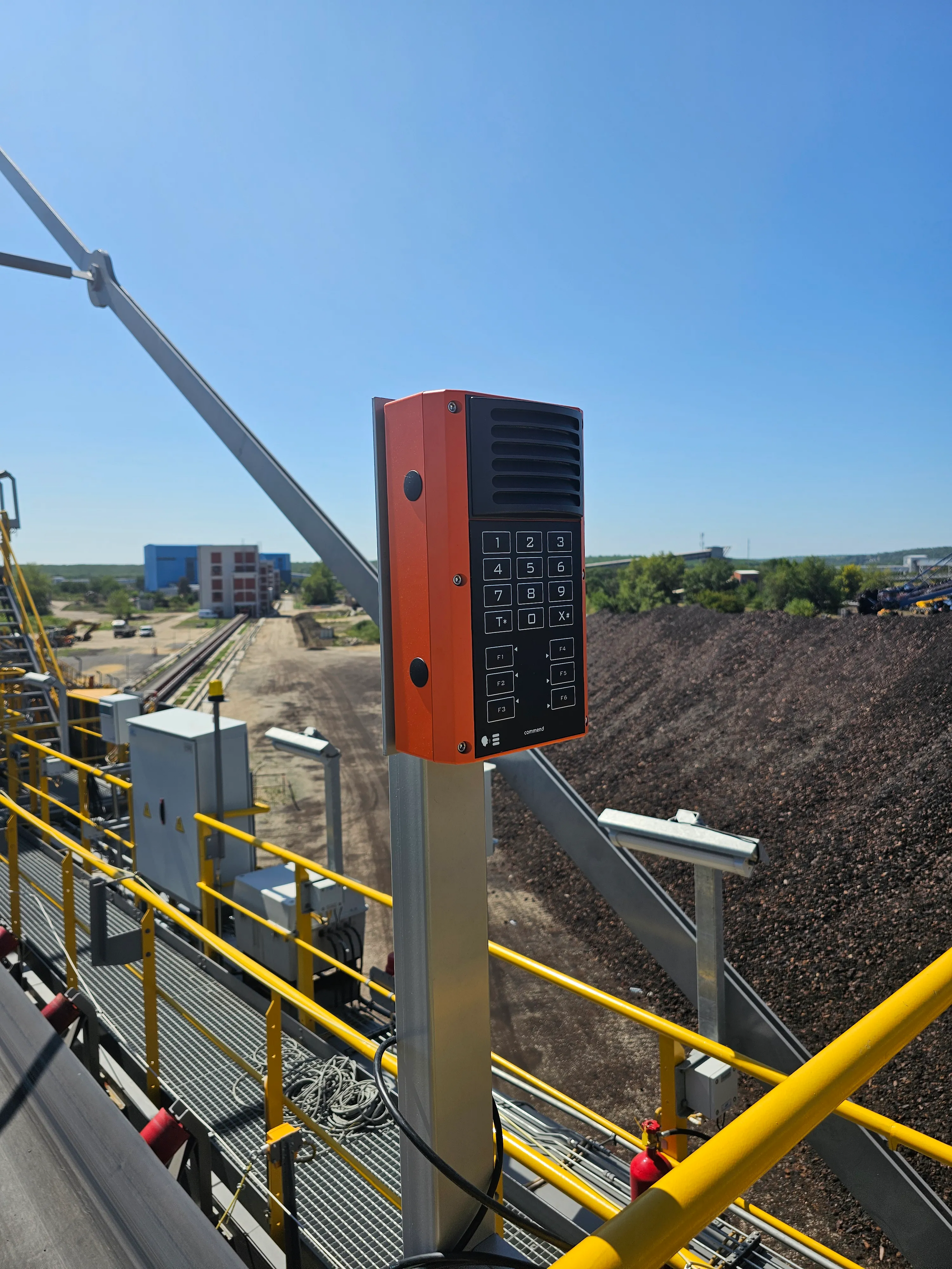 Industrial intercom with keypad on outdoor conveyor platform