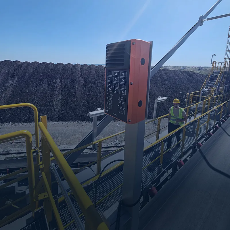 Industrial intercom with keypad on conveyor walkway installation
