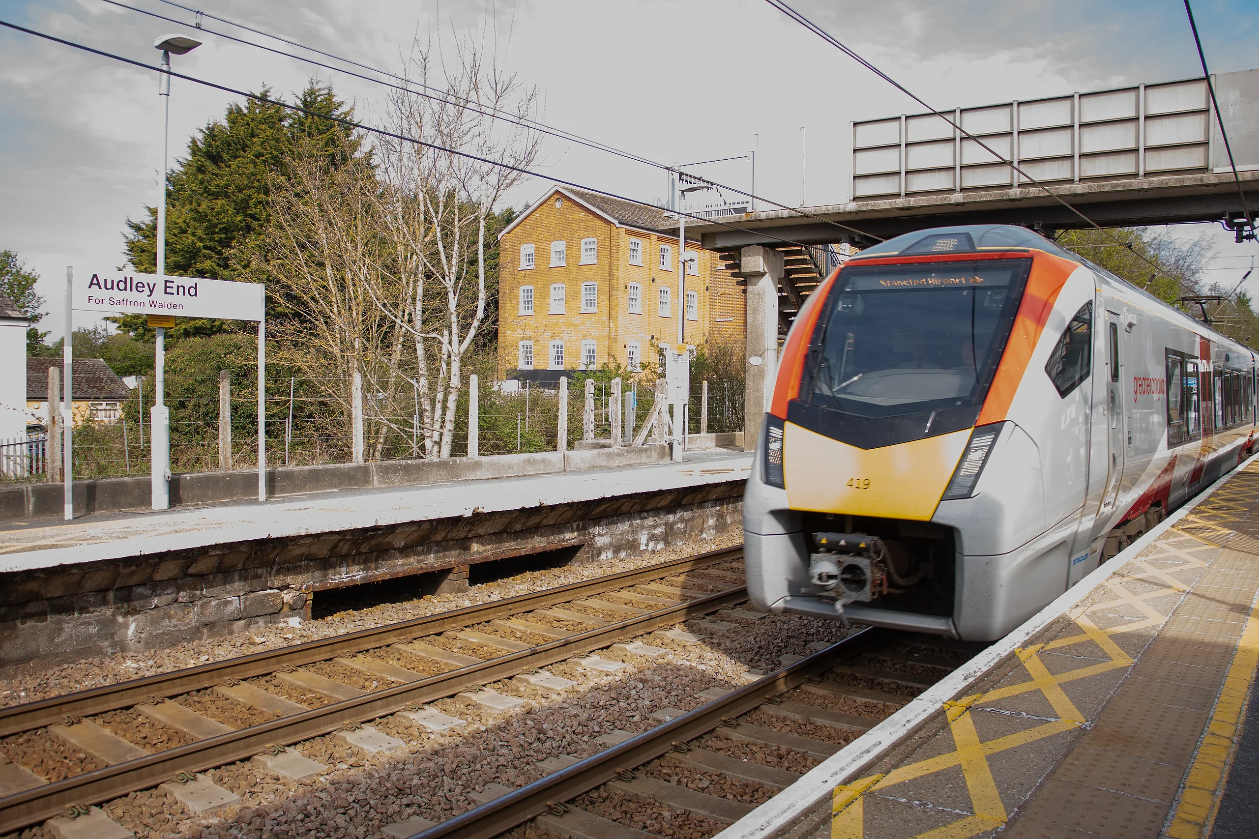 Passenger train at a railway station with modern communication system