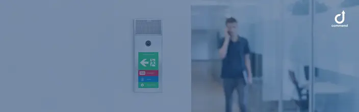 Modern Intercom for Building Security Wall-mounted Commend intercom with emergency and info buttons in an office.