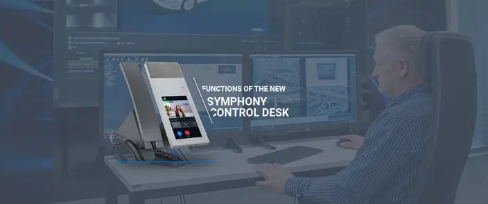 New Symphony Control Desk Intercom Man at a desk operating a control panel with multiple screens and a modern intercom showing a video call.